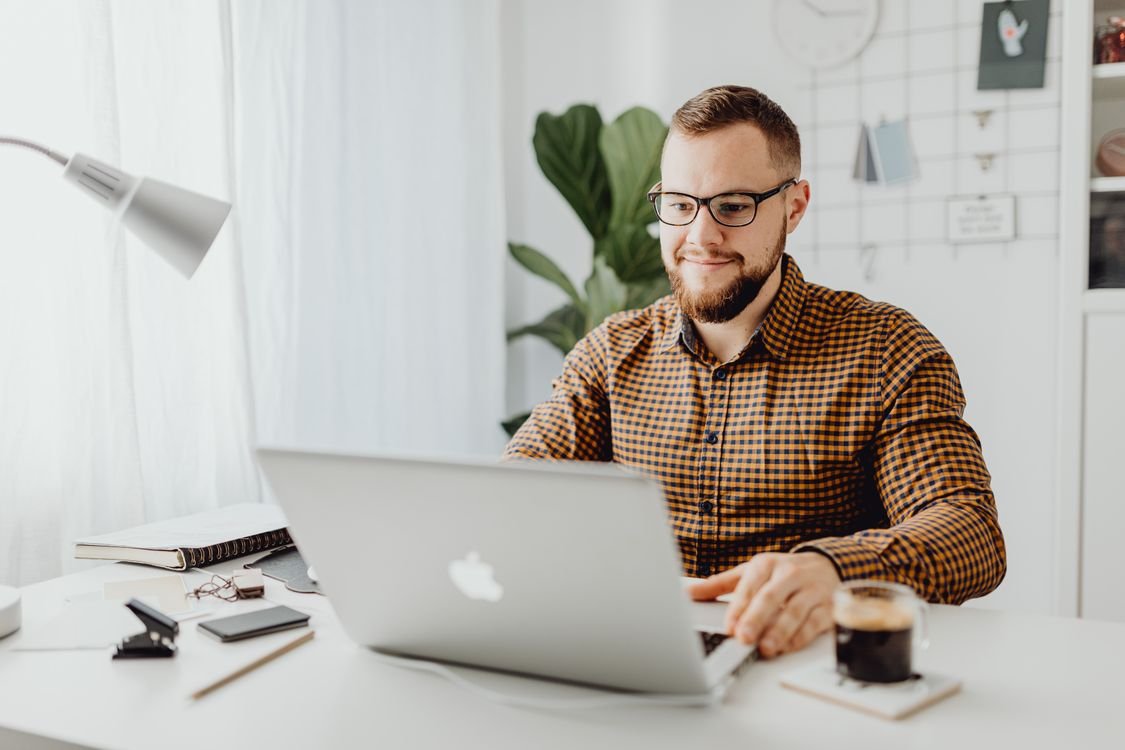 Professional reviewing automated workflows on a laptop