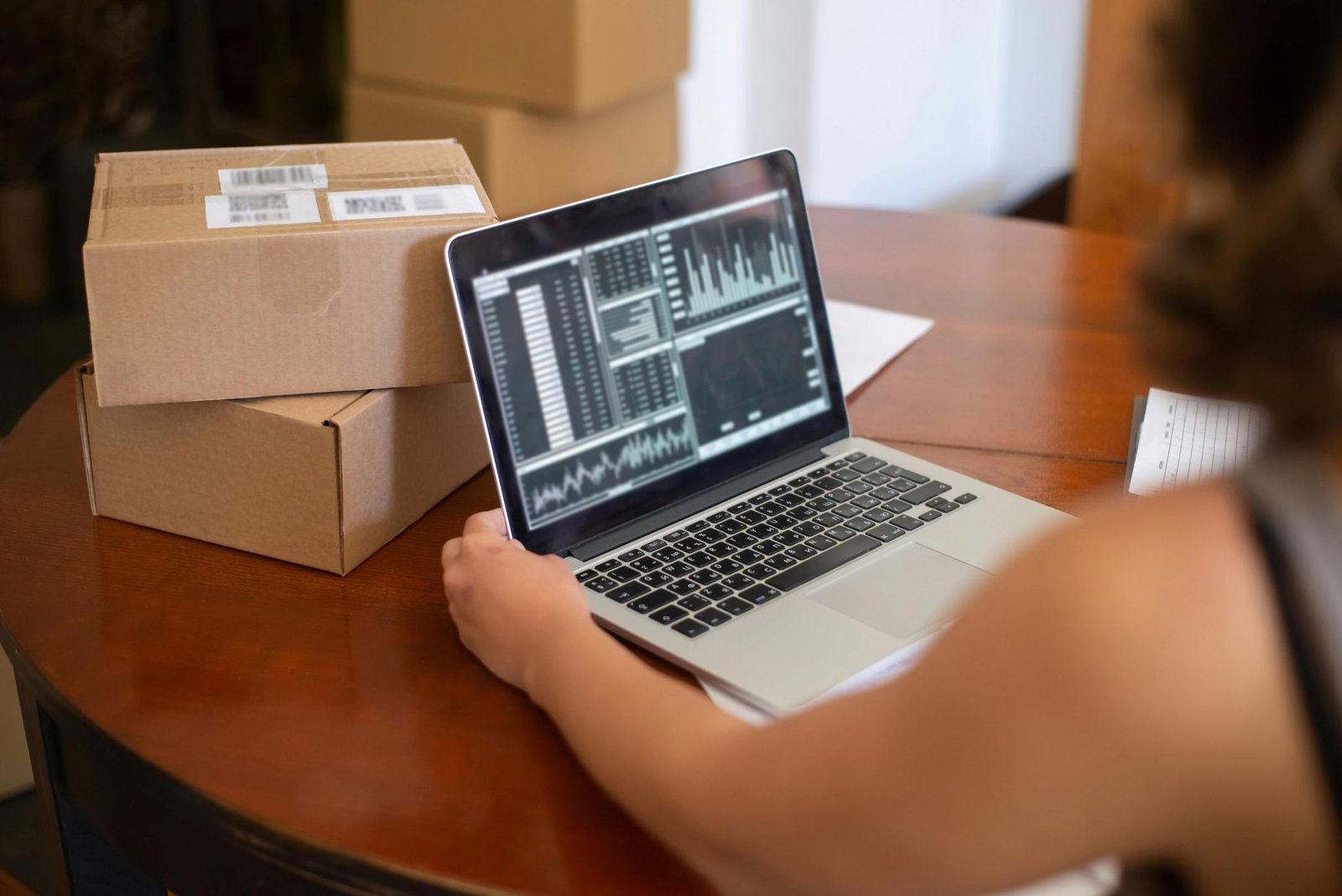 Ecommerce founder reviewing fulfillment analytics on laptop